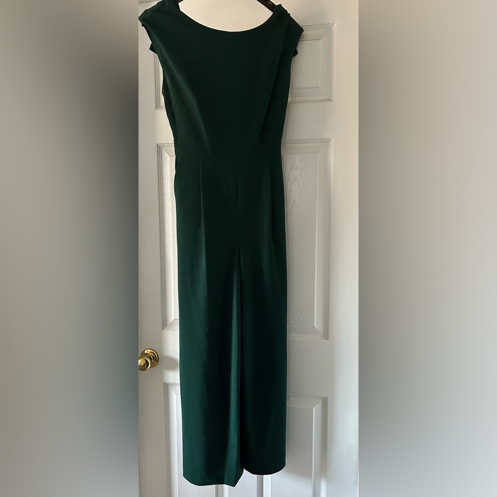 Calvin Klein green jumpsuit with flared legs, tie back at waist. Size 6